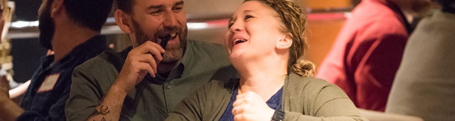 Couple Laughing Couple laughing at murder mystery dinner theatre