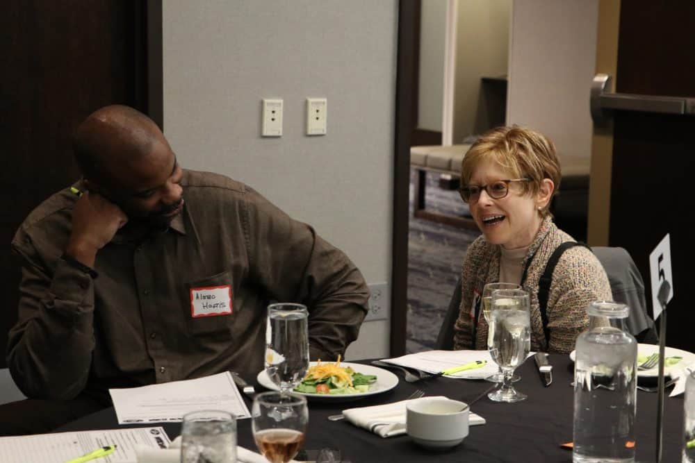 Colleagues collaborating during the corporate murder mystery experience