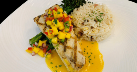 Fresh fish entrée, the chef’s catch of the day, served with a side of seasonal vegetables.
