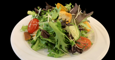 Fresh organic mixed field greens salad served with a light vinaigrette dressing.