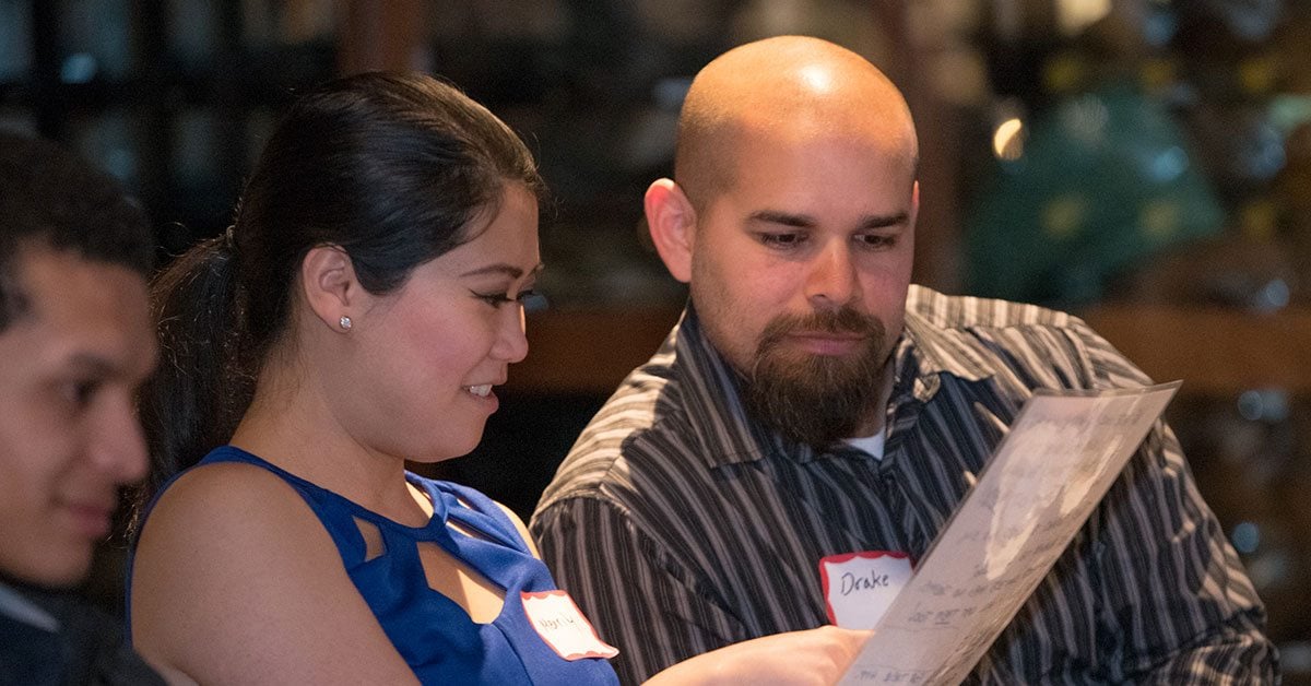 Couple looking at murder mystery clues