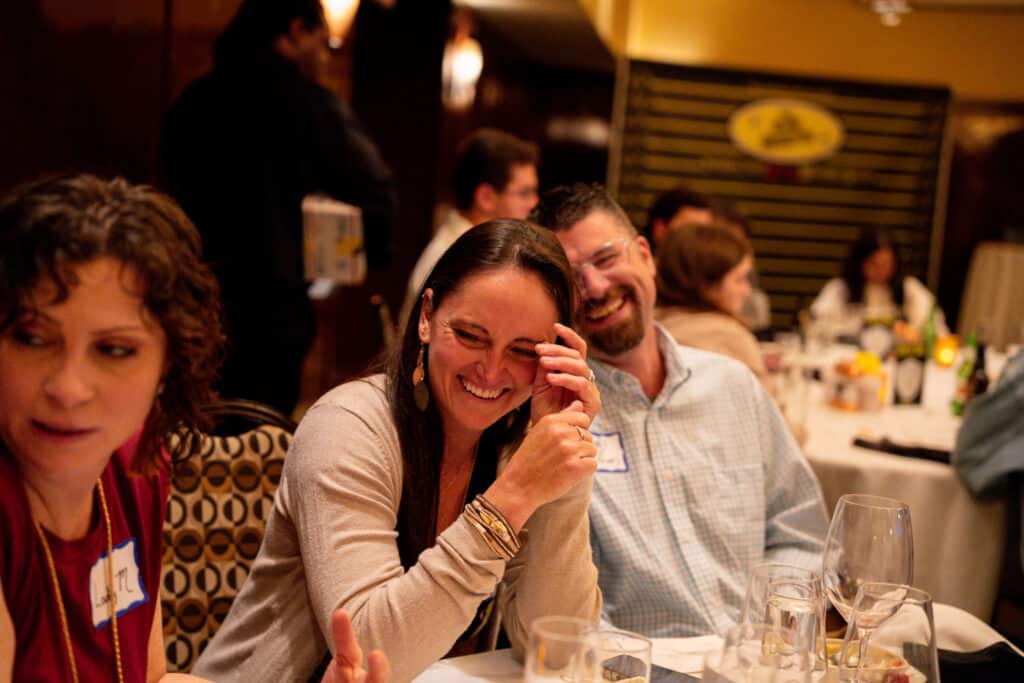 Guests laugh and enjoy a hilarious moment during a Lexington KY private murder mystery dinner event by The Dinner Detective.