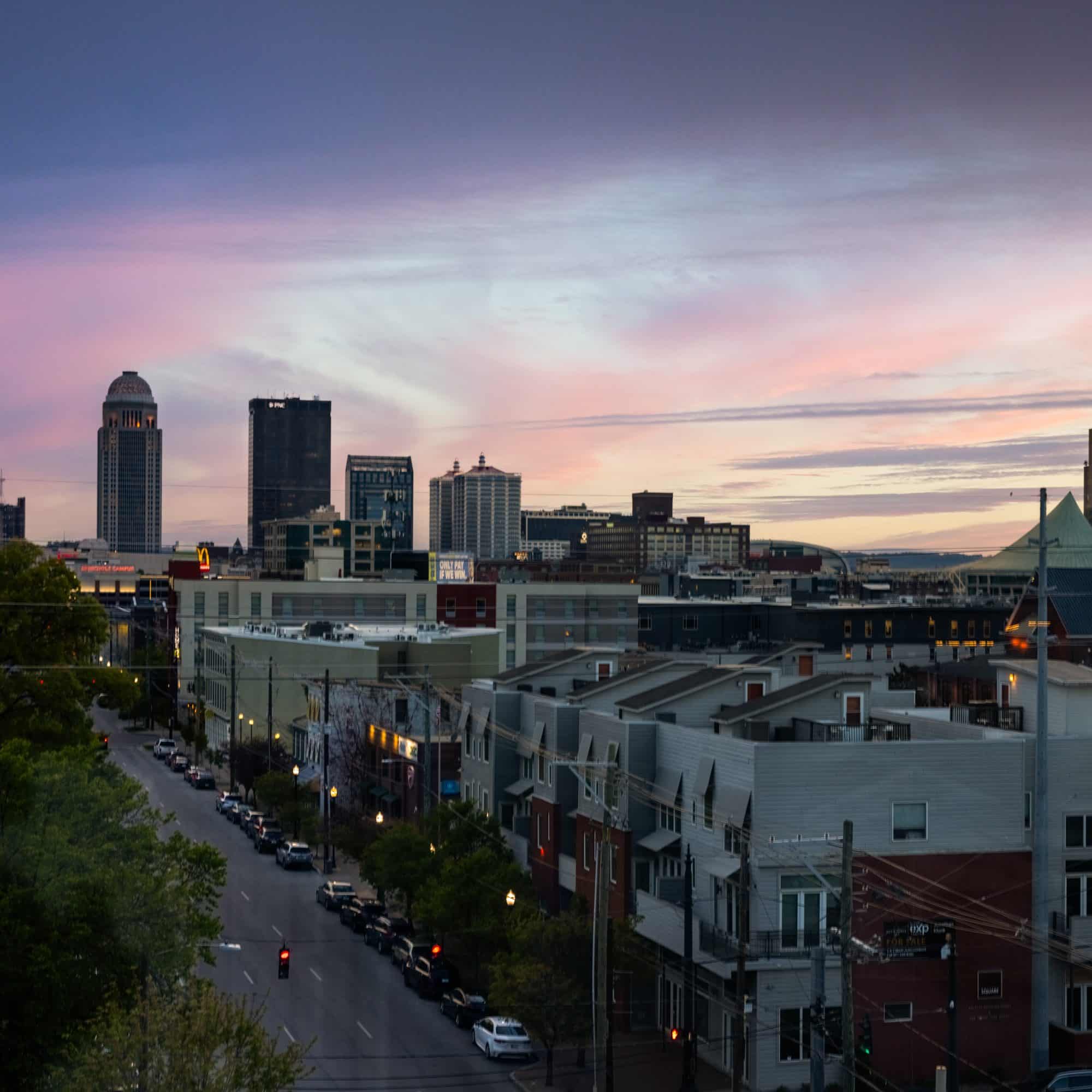 Panoramic view of the Louisville skyline at dusk as seen from the NuLu neighborhood rooftop.