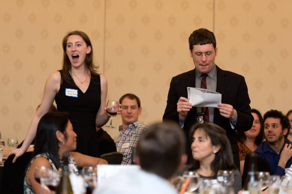 Actors blend with the audience during a live performance of The Dinner Detective interactive murder mystery dinner show in Salt Lake City.