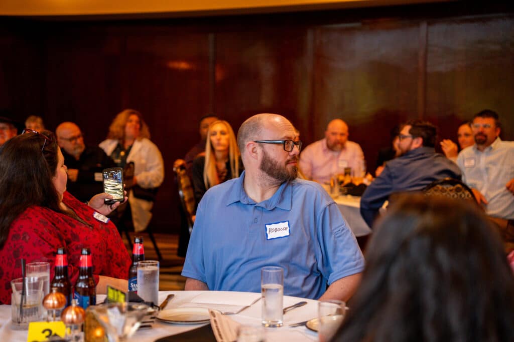 Guests react and pay close attention during a key moment at The Dinner Detective’s interactive show.