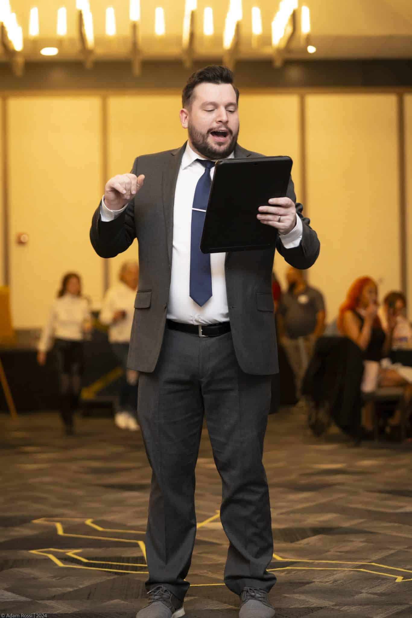 Man in suit hosting interactive dinner show in San Francisco