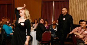 Murder mystery dinner party guests acting dramatic scene