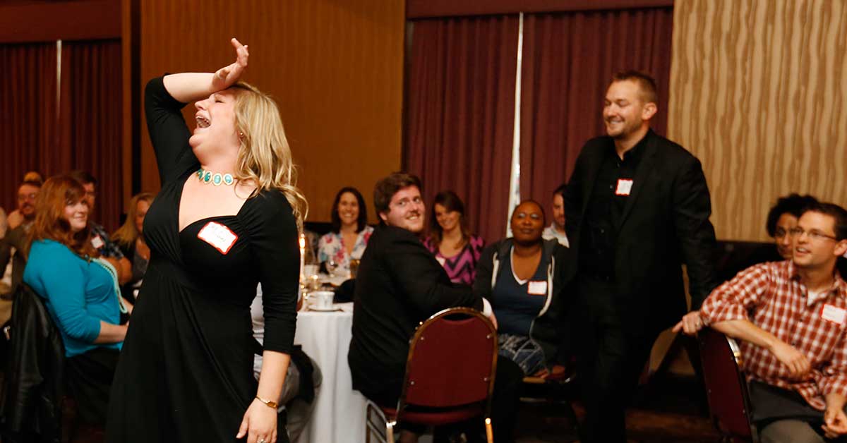 Murder mystery dinner party guests acting dramatic scene