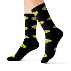 A person wearing Sublimation Socks featuring a vibrant pattern of yellow ovals and text.