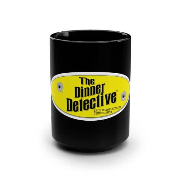 A glossy 15oz Black Mug features The Dinner Detective vibrant yellow logo, True Crime Mystery Dinner Show text, and subtle bullet hole graphics.