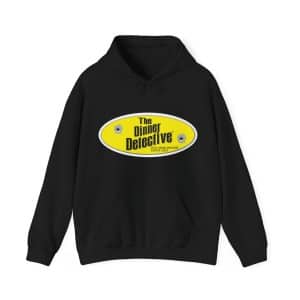 The Unisex Heavy Blend™ Hooded Sweatshirt is a black hoodie with a bold oval yellow logo displaying The Dinner Detective and two bullet holes. Designed for ultimate comfort and style, it makes a striking statement.