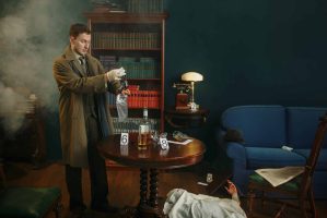 A detective in a brown coat scrutinizes a dagger in a plastic bag, standing over a round table set for a Murder Mystery Dinner. Evidence markers and a whiskey bottle dot the scene. A body lies near the blue sofa, smoke swirling to enhance the enigmatic atmosphere.